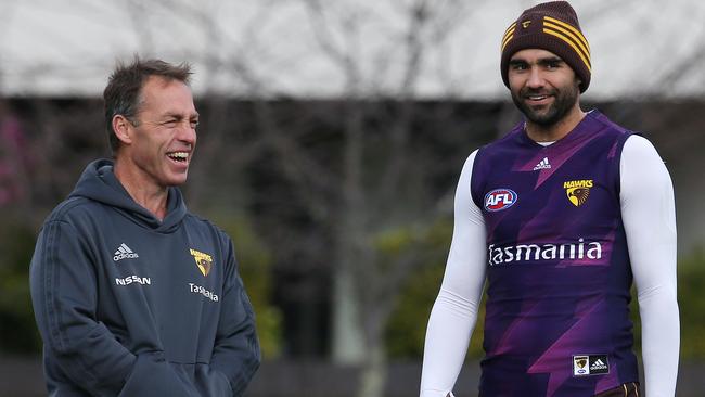 Burgoyne chats with coach Alastair Clarkson at Hawthorn training this week. Pic: Michael Klein