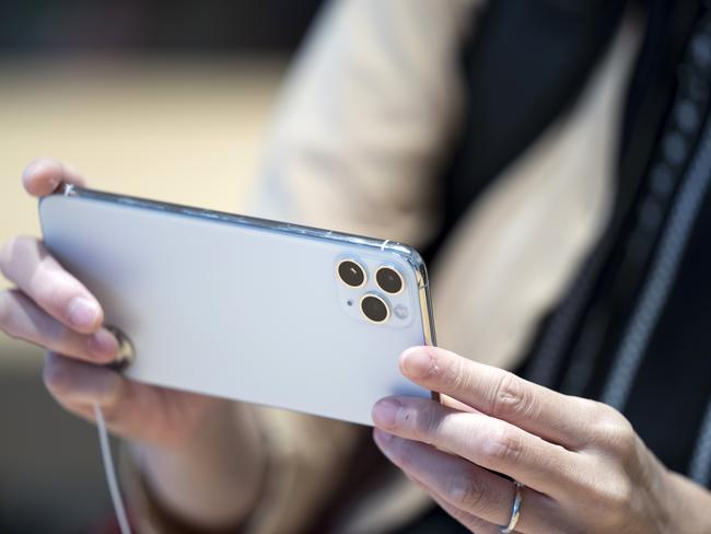 TOKYO, JAPAN - SEPTEMBER 20: A customer tries an iPhone 11 in the Apple Marunouchi store on September 20, 2019 in Tokyo, Japan. Apple Inc. launched the latest iPhone 11 models featuring a dual-camera system today.  (Photo by Tomohiro Ohsumi/Getty Images)