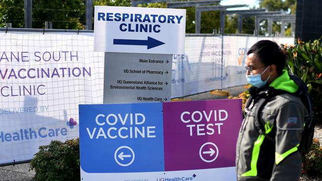 Signposts to beating the virus outside a Covid vaccine and testing clinic in Brisbane. Picture: NCA NewsWire / Dan Peled