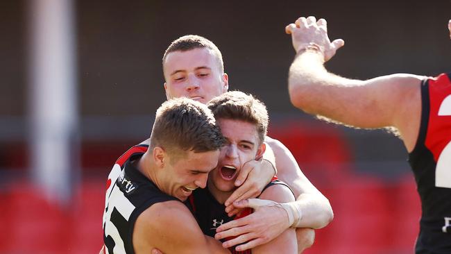 AFL Round 18. North Melbourne vs Essendon at Metricon stadium, Gold Coast . 18/07/2021.   Brayden Ham of Bombers celebrates a last qtr goal with Matt Guelfi   .  Pic: Michael Klein