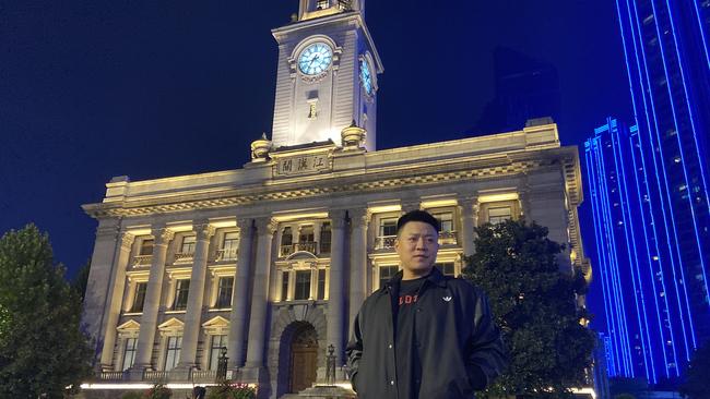 A visitor to Wuhan’s former foreign concession area poses in front of Hankou’s Custom House museum. Picture: Will Glasgow