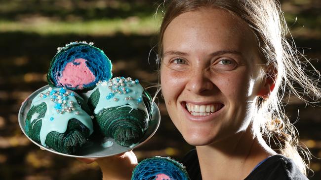 Susannah Hunt holds a Mermaid Croissant with fairy floss flavoured filling at Bam Bam Bakehouse. Picture Glenn Hampson