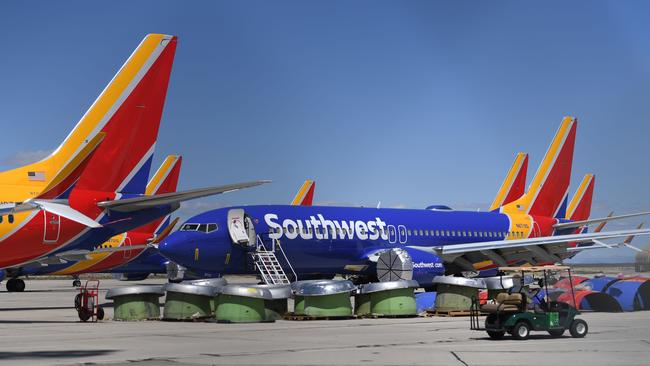 Southwest Airlines Boeing 737 MAX aircraft are parked on the tarmac after being grounded, at the Southern California Logistics Airport in Victorville, California on March 28, 2019. - After two fatal crashes in five months, Boeing is trying hard -- very hard -- to present itself as unfazed by the crisis that surrounds the company. The company's sprawling factory in Renton, Washington is a hive of activity on this sunny Wednesday, March 28, 2019, during a tightly-managed media tour as Boeing tries to communicate confidence that it has nothing to hide. Boeing gathered hundreds of pilots and reporters to unveil the changes to the MCAS stall prevention system, which has been implicated in the crashes in Ethiopia and Indonesia, as part of a charm offensive to restore the company's reputation. (Photo by Mark RALSTON / AFP)