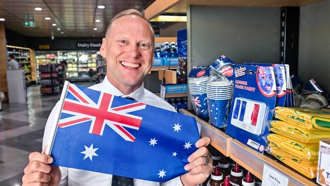 John-Paul Drake with an Australia Day flag in his Wayville store. Picture: Brenton Edwards