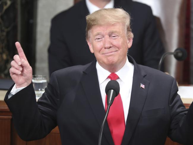 President Donald Trump gestures as a conductor as people in the chamber sing "Happy Birthday" to Judah Samet as he delivers his State of the Union address to a joint session of Congress on Capitol Hill in Washington, Tuesday, Feb. 5, 2019. Same turned 81 on Tuesday. (AP Photo/Andrew Harnik)