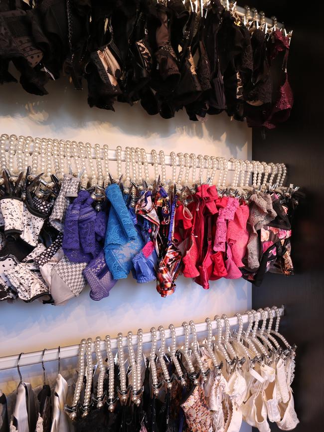 Nina hangs her lingerie in sets from pearl hangers.