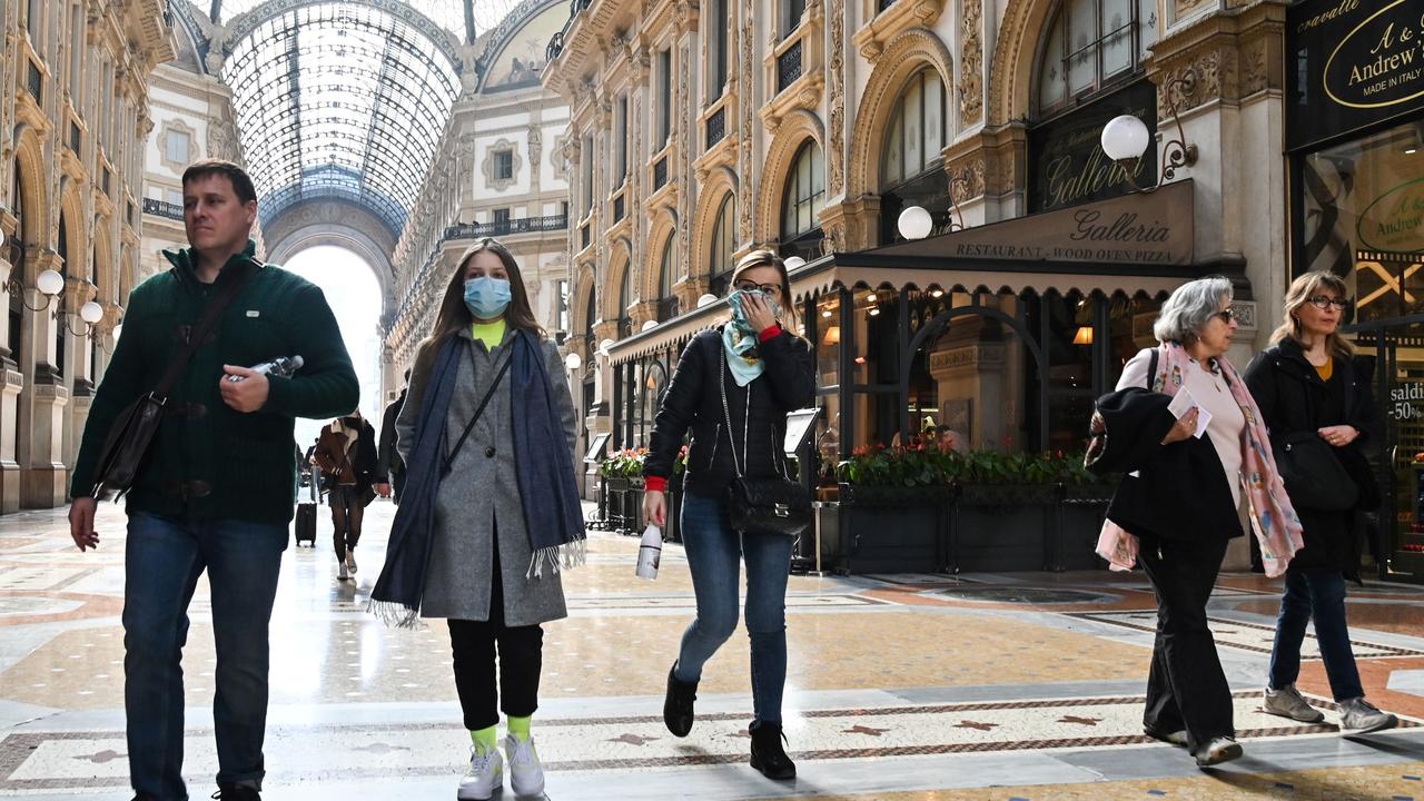 People wearing a protective face masks visit the Gallery Vittorio Emanuele II, in central Milan. Picture: AFP/Andreas SOLARO