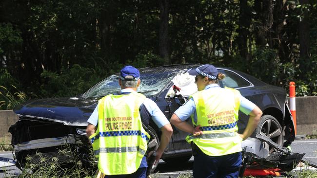 An allegedly stolen vehicle lays upside down on the Pacific HIghway at Chinderah. Photo: Scott Powick.