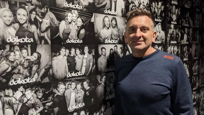 Owner Joe Cossari next to the Club Dakota tribute wall, which will be inside the rebuilt Baby nightclub in Ringwood. Picture: Kiel Egging.