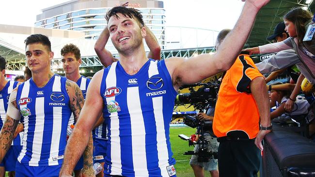 Luke McDonald celebrates the Good Friday win with fans. Picture: Getty Images