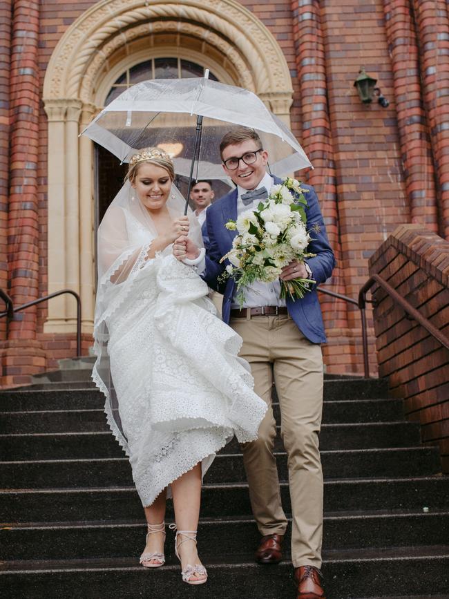 Leaving the church in the rain, Amelia Small and Jackson Law, pic: Shane Shepherd