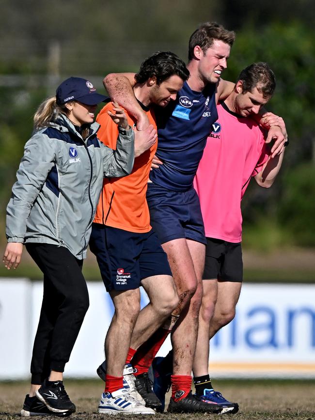 Old Melburnians Nick De Steiger taken off injured during the VAFA football match between Old Melburnians and Old Xaverians in Brighton. Picture: Andy Brownbill