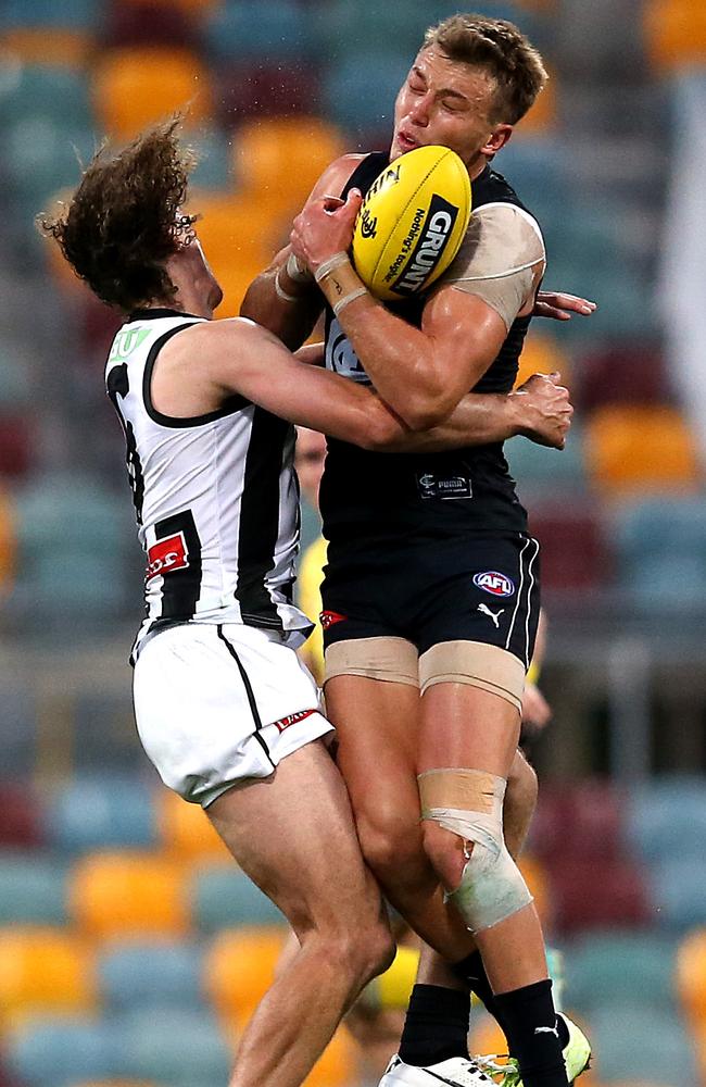 Chris Mayne and Patrick Cripps collide during Sunday’s match. Picture: Jono Searle/AFL Photos/via Getty Images