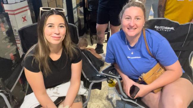 Shennay Hand (left) and Kimberley Andrews (right) sat in camp chairs as they waited for “Lambo Guy” Adrian Portelli to arrive. Picture: Elizabeth Neil