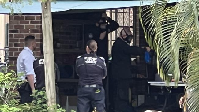 Emergency services examining drugs equipment found at a Pacific Pines home. Picture: Keith Woods