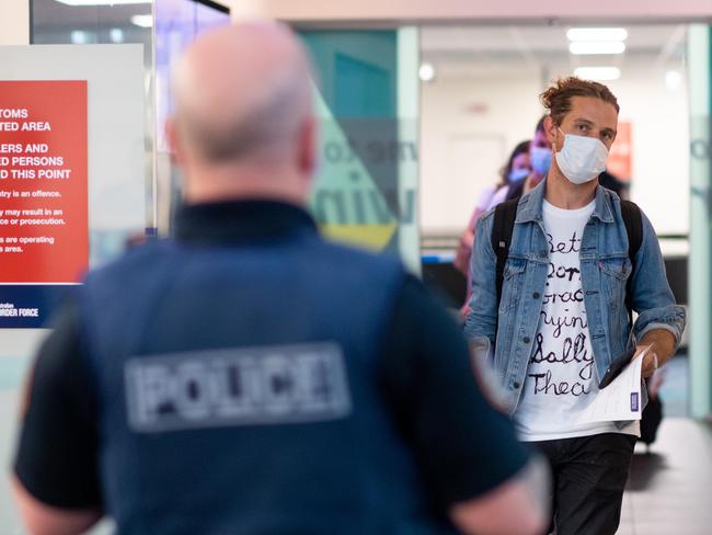 Two flights arriving to Darwin have been quarantined after the Northern Territory has once more closed its borders to South Australia. Passengers were in the air when the decision was made. QF860 and JQ692 arrived at Darwin Airport and passengers were given the option to return to Adelaide or quarantine for two weeks in Howard Springs. Picture: Che Chorley