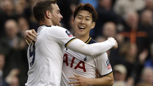 Tottenham's Heung-Min Son celebrates with Vincent Janssen.