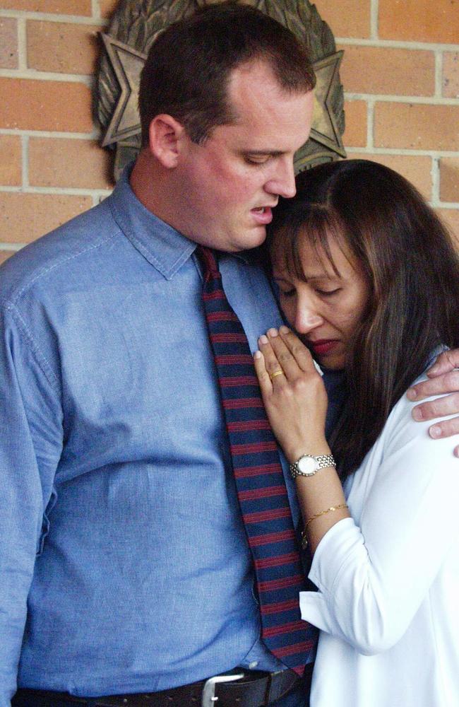 Investigative journalist Hedley Thomas and his wife Ruth outside the Indooroopilly Police Station after their home was shot at. (AAP Image/Gillian Ballard)