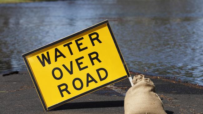 water over the road sign