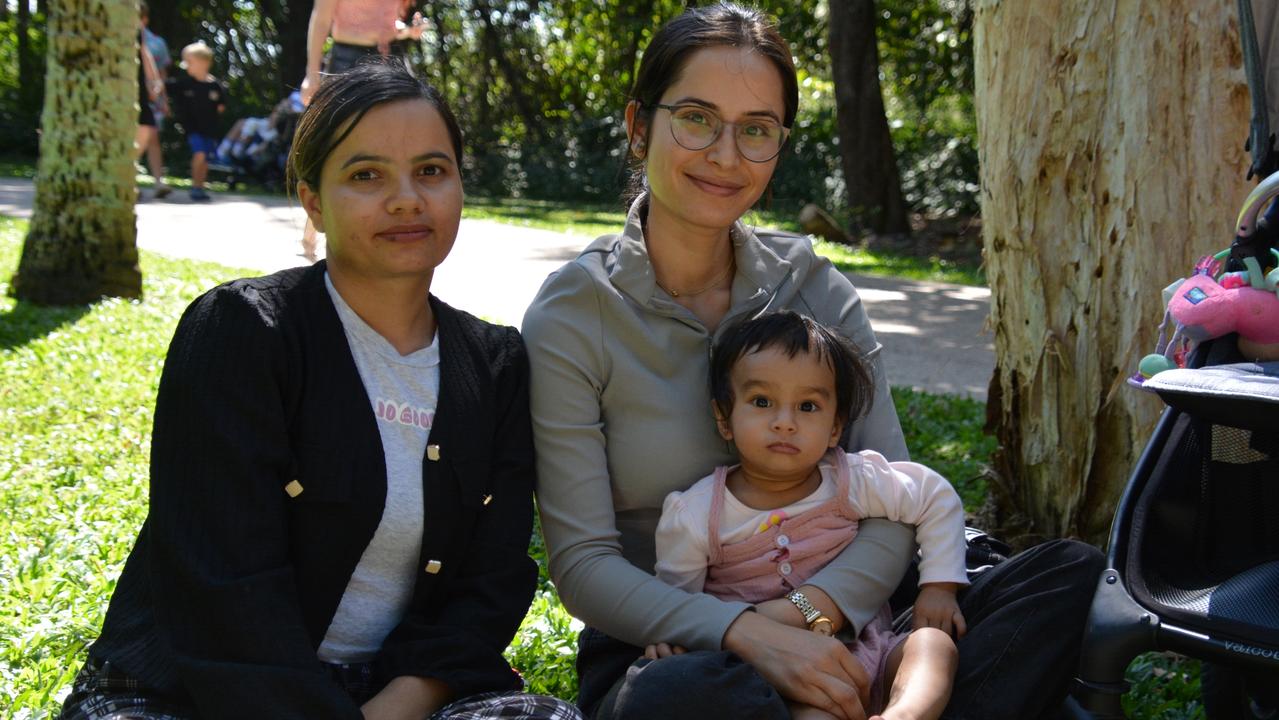 Srijana Bhattarai, Rabina Parajuli, and Ariyah Gautam, 14 months, relaxing at the 2024 Festival of the Knob at Yorkeys Knob on Saturday. Picture: Bronwyn Farr