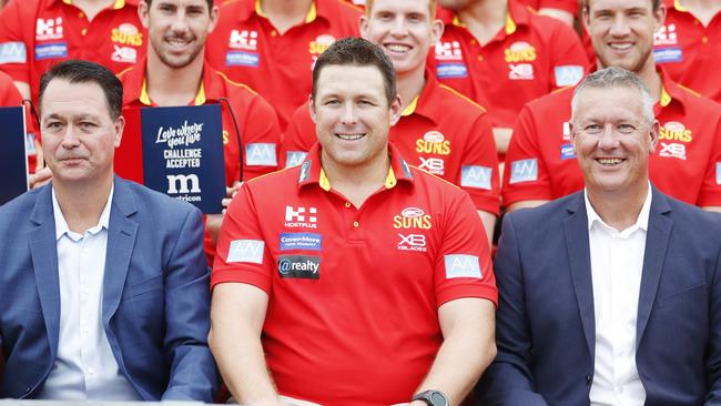 Metricon director Queensland Jason Biasin, Gold Coast Suns coach Stuart Dew and Suns CEO Mark Evans among players during the announcement in 2019 about ongoing support for the Suns from Metricon and to open the new Terrace viewing area. Picture: Tim Marsden