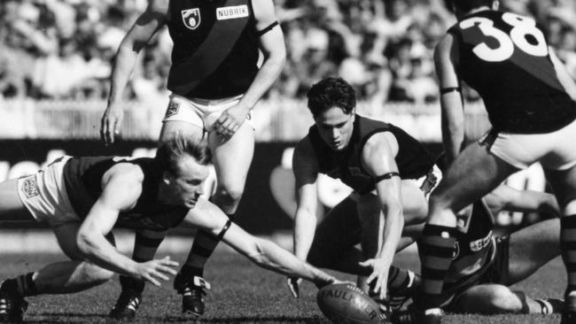 David Grenvold and Gavin Wanganeen fighting for the ball.