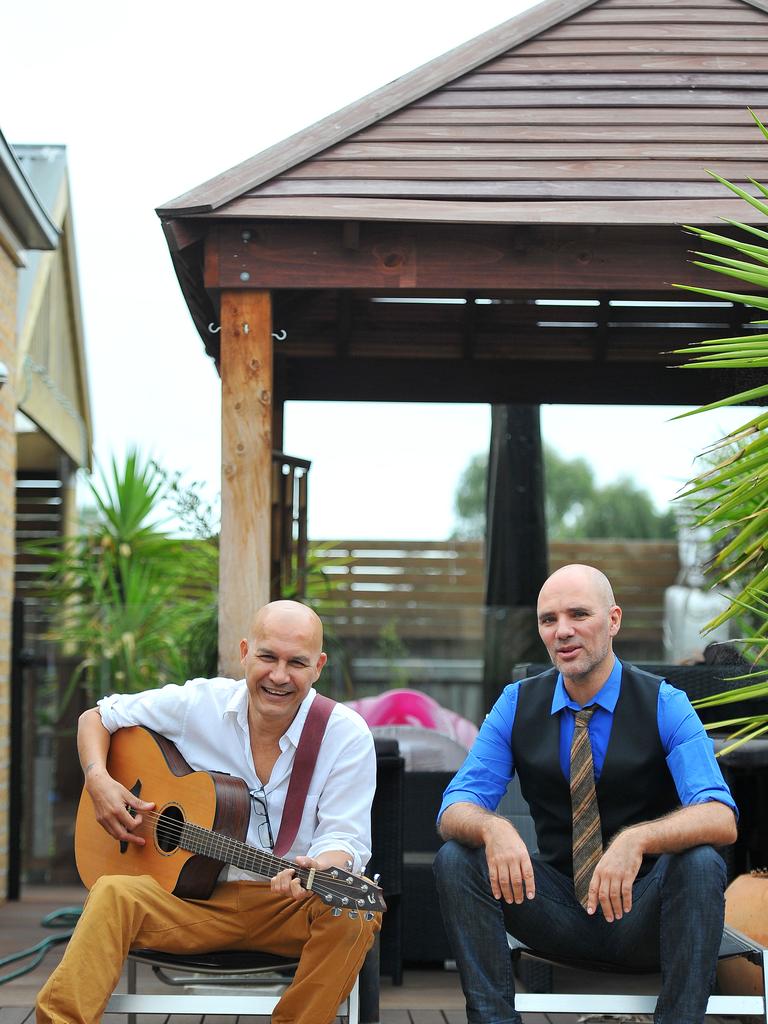 Pictured is lead singer of legendary group Boom Crash Opera, Dale Ryder at his home in Lynbrook with fellow band member Ian Tilley. Picture: Derrick den Hollander