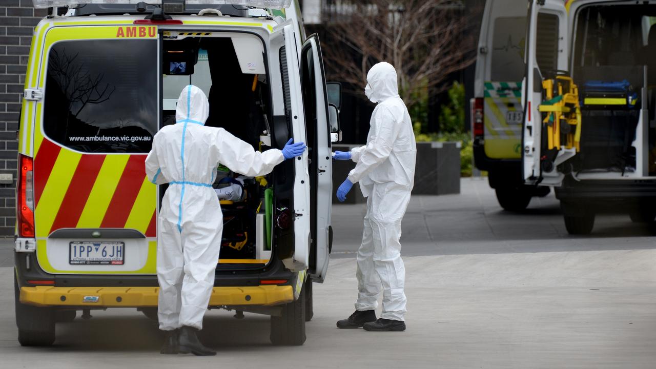 MELBOURNE, AUSTRALIA – NewsWire Photos JULY 28: Paramedics wearing PPE prepare to transport residents of Epping Gardens Aged Care to hospital. Picture: NCA NewsWire / Andrew Henshaw