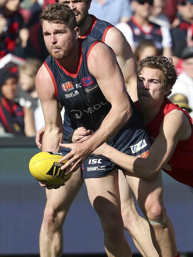 McKenzie is tackled by North’s Boyd Woodcock during the 2018 SANFL grand final. Picture: Sarah Reed