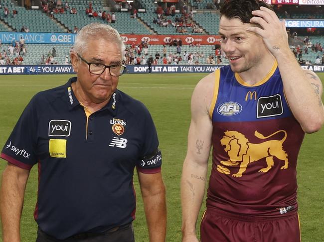 SYDNEY, AUSTRALIA - MARCH 15: Chris Fagan, coach of the Brisbane Lions chats with Lachie Neale of the Lions after the round one AFL match between Sydney Swans and Brisbane Lions at Sydney Cricket Ground, on March 15, 2025, in Sydney, Australia. (Photo by Darrian Traynor/AFL Photos/via Getty Images)