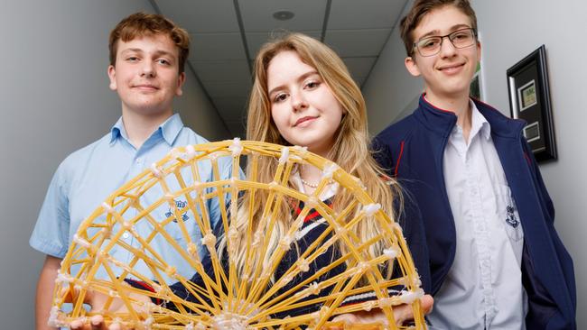 Transurban bridge building competition for school students, who used pasta to try and build the strongest or best looking bridge design. Pictured are winners of the Transurban prize for creative bridge design, Gosford High year 10 students Flynn Henry, Tamsin Conti and Charlie Manns. 09/08/2024. Picture by Max Mason-Hubers