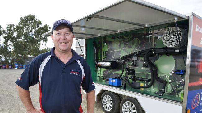 Blow me down: Richard Nagorcka with the Tornado Harvester Air Flow System, which helps to prevent header fires. The fan system blows air on to the susceptible areas of the harvester, removing dust that would otherwise accumulate. Picture: Dannika Bonser 