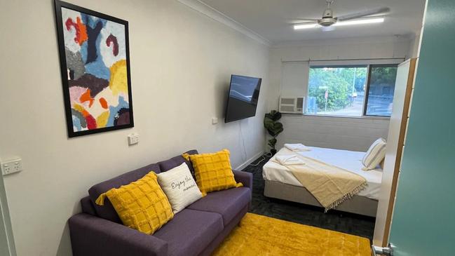 This hotel-style room comes with a private bathroom, TV, couch and ceiling fan. Picture: Airbnb