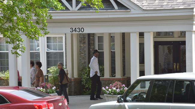 By her side ... Whitney Houston's former bodyguard Ray Watso arrives at the Peachtree Christian Hospice.