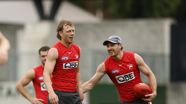 Mills, getting encouragement from Harry Cunningham, did everything he could at the training session. (Photo by Phil Hillyard)