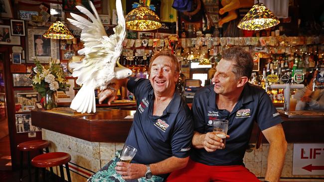 George the cockatoo, pictured with publican brothers Michael and Peter Byrnes, will live out the remainder of his days at the pub. Picture: Sam Ruttyn