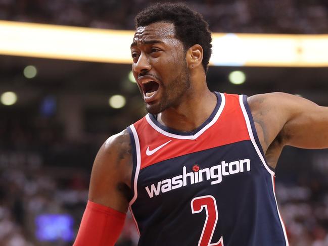 TORONTO, ON - APRIL 14: John Wall #2 of the Washington Wizards reacts against the Toronto Raptors in the third quarter during Game One of the first round of the 2018 NBA Playoffs at Air Canada Centre on April 14, 2018 in Toronto, Canada. NOTE TO USER: User expressly acknowledges and agrees that, by downloading and or using this photograph, User is consenting to the terms and conditions of the Getty Images License Agreement.   Tom Szczerbowski/Getty Images/AFP == FOR NEWSPAPERS, INTERNET, TELCOS & TELEVISION USE ONLY ==