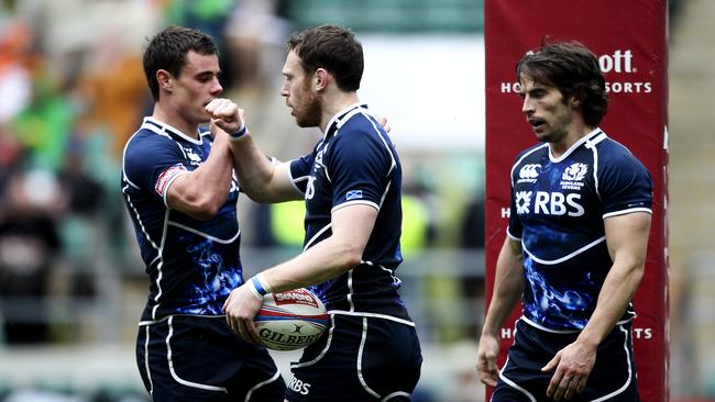 Andrew Turnbull of Scotland celebrates with team mates after scoring a try.