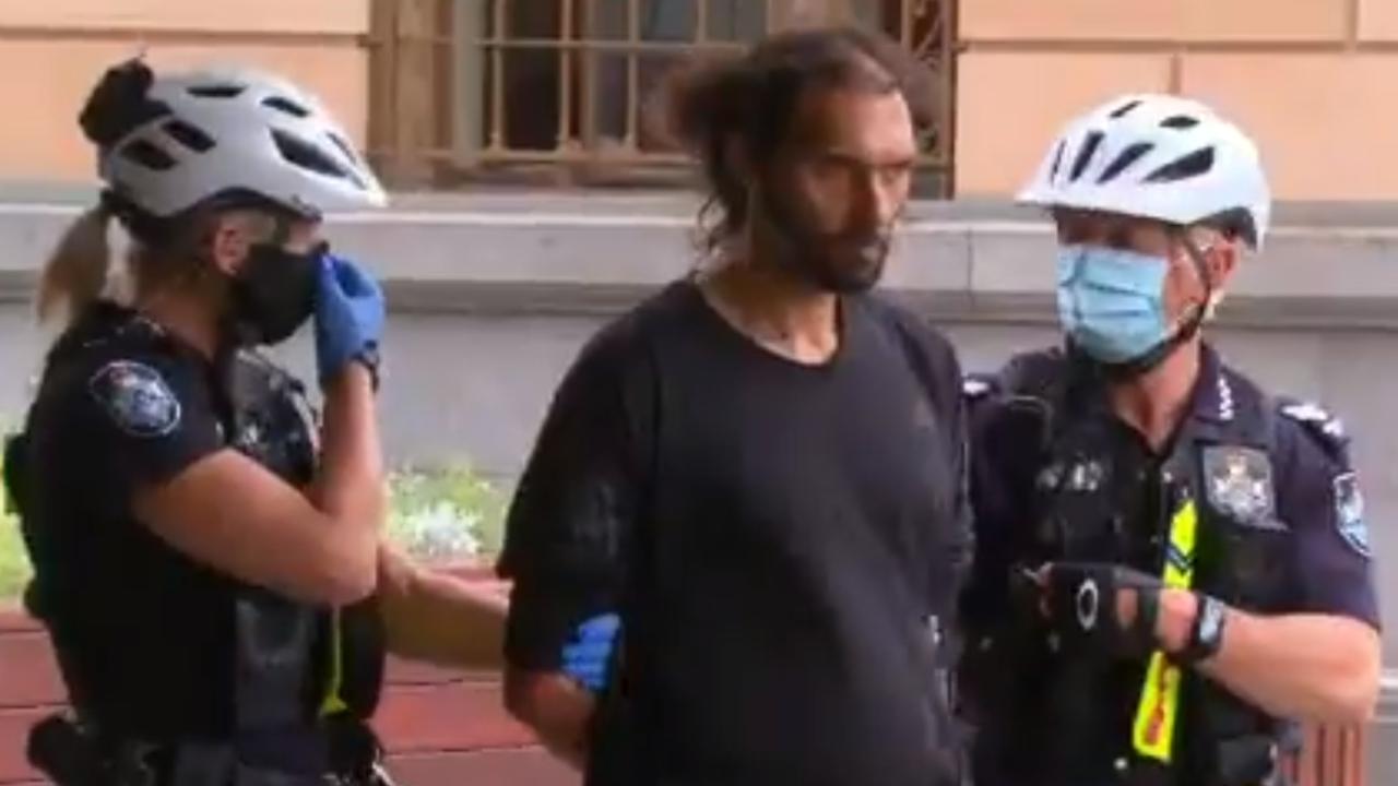 A man handcuffed for not wearing a mask. Picture: Nine News Queensland