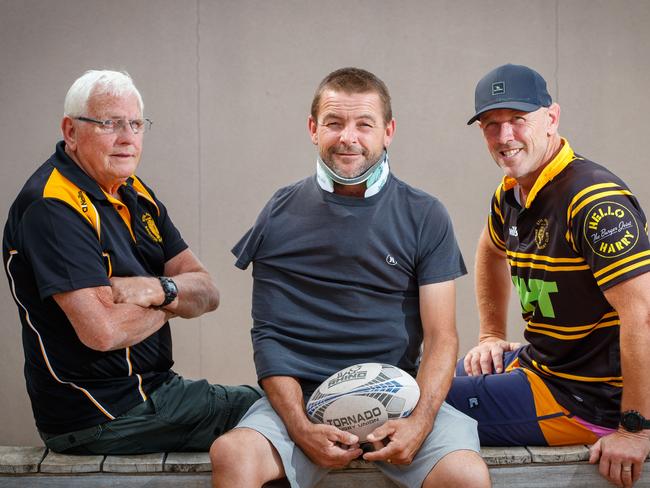 Damian Bruce (centre) with former coach Barry Cooper and old team mate Richard Wasley on December 11, 2020 in Aldinga Beach. Damian is unable to work for six months after breaking his neck jumping in the family pool.