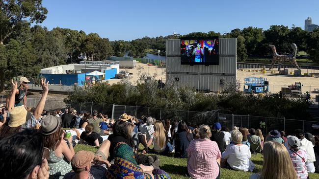 The crowd at Birrarung Marr Park after Federation Square filled up for Robbie Williams' concert. Picture: NewsWire / Ryan Bourke