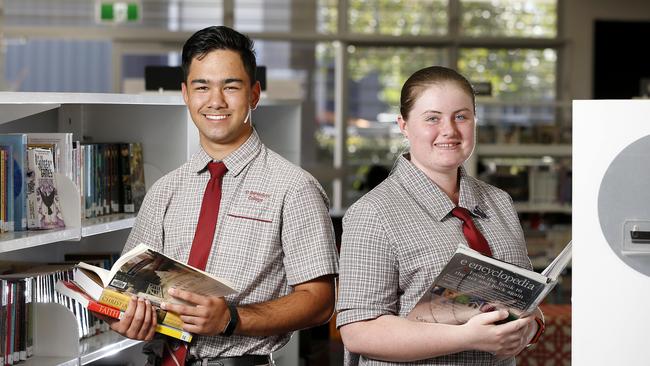 Students Fabian Sampson and Erin Brown at St Benedict's College at Mango Hill. Photo: AAP /Josh Woning