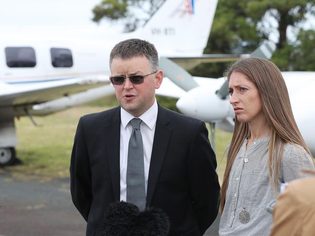 Par Avion Managing Director Shannon Wells, standing beside wife Sarah Wells, speaks about the plane crash near the Western Arthurs resulting in the death of a Par Avion pilot. Picture: LUKE BOWDEN