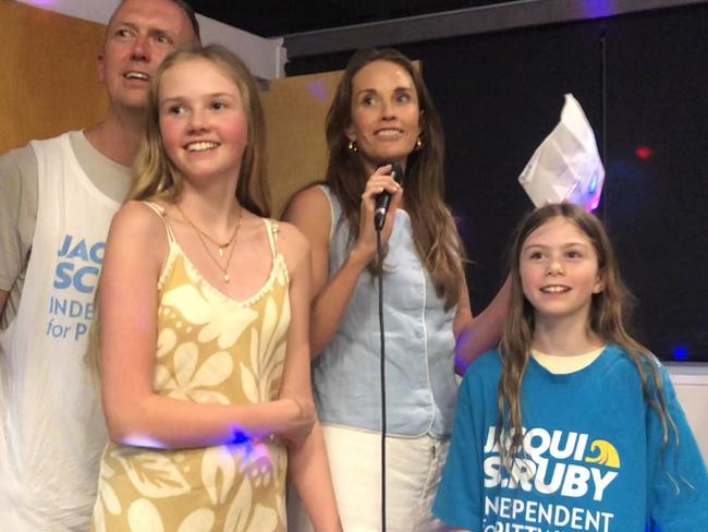 Independent candidate for the Pittwater by-election, Jacqui Scruby, celebrates her likely victory on Saturday night with her husband Michael and their two daughters at the Avalon Beach Surf Life Saving Club. Picture: Jim O’Rourke