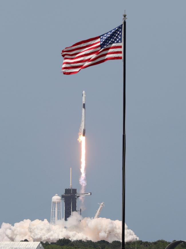 A SpaceX Falcon 9 rocket carrying the Crew Dragon spacecraft lifts off from launch complex 39A at the Kennedy Space Center in Florida.