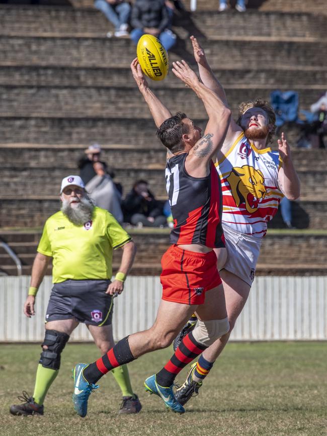 Keith Webb for Bombers and Ethan Carmody for Cougars. South Toowoomba Bombers vs University Cougars. 2022 AFLDD Allied Cup - senior men. Saturday, June 11, 2022. Picture: Nev Madsen.