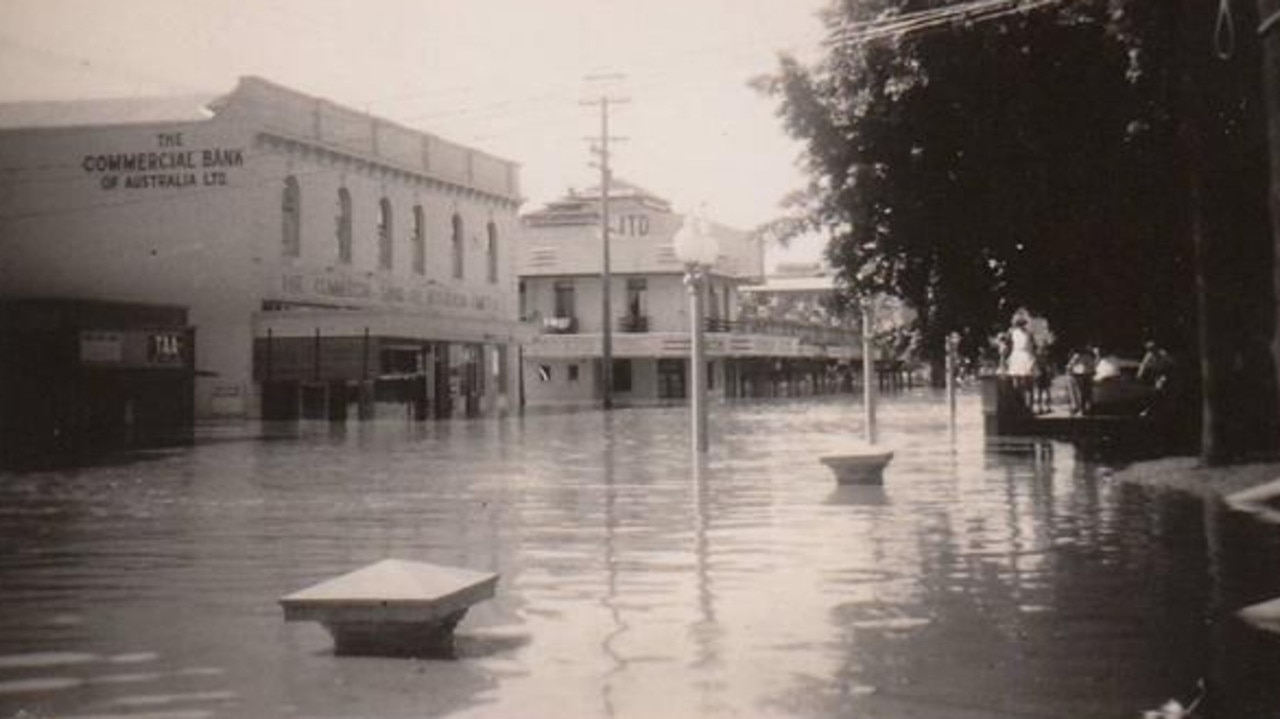 Commercial strip flooded during the 1955 Flood, Maryborough. A commercial area, including the Commercial Bank of Australia, overtaken by the devastating flood. Source: Unknown