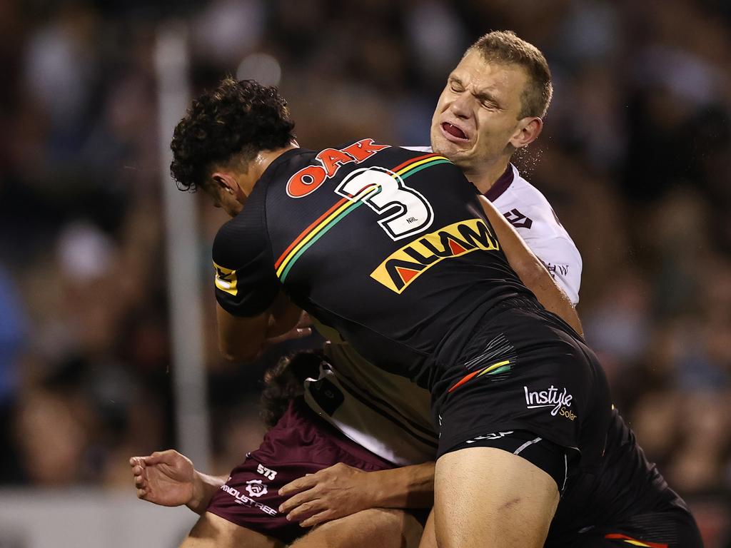 Tom Trbojevic of the Sea Eagles is tagged by Izack Tago. Picture: Cameron Spencer/Getty Images)