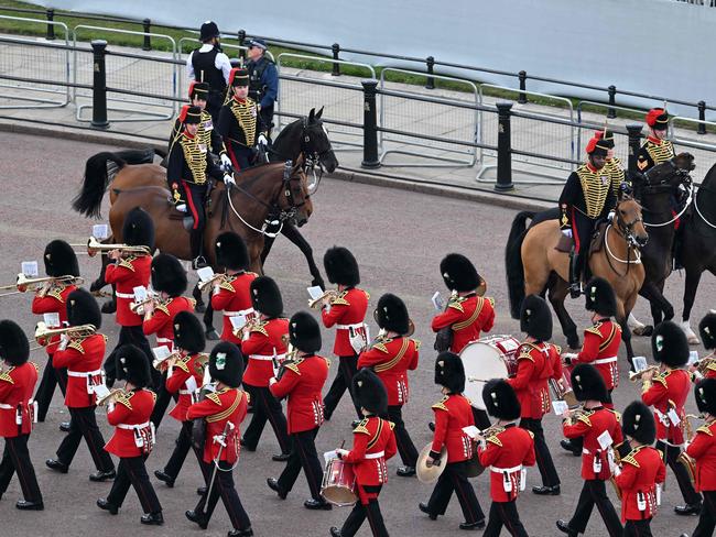 The Band of the Welsh Guards pass members of the Kings Troop Royal Horse Artillery on their way to the Queen's Birthday Parade, Trooping the Colour. Picture: AFP