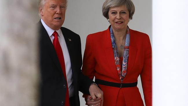 Don’t worry Mr Trump, Theresa May has your back ... and hand. Picture: Christopher Furlong/Getty Images